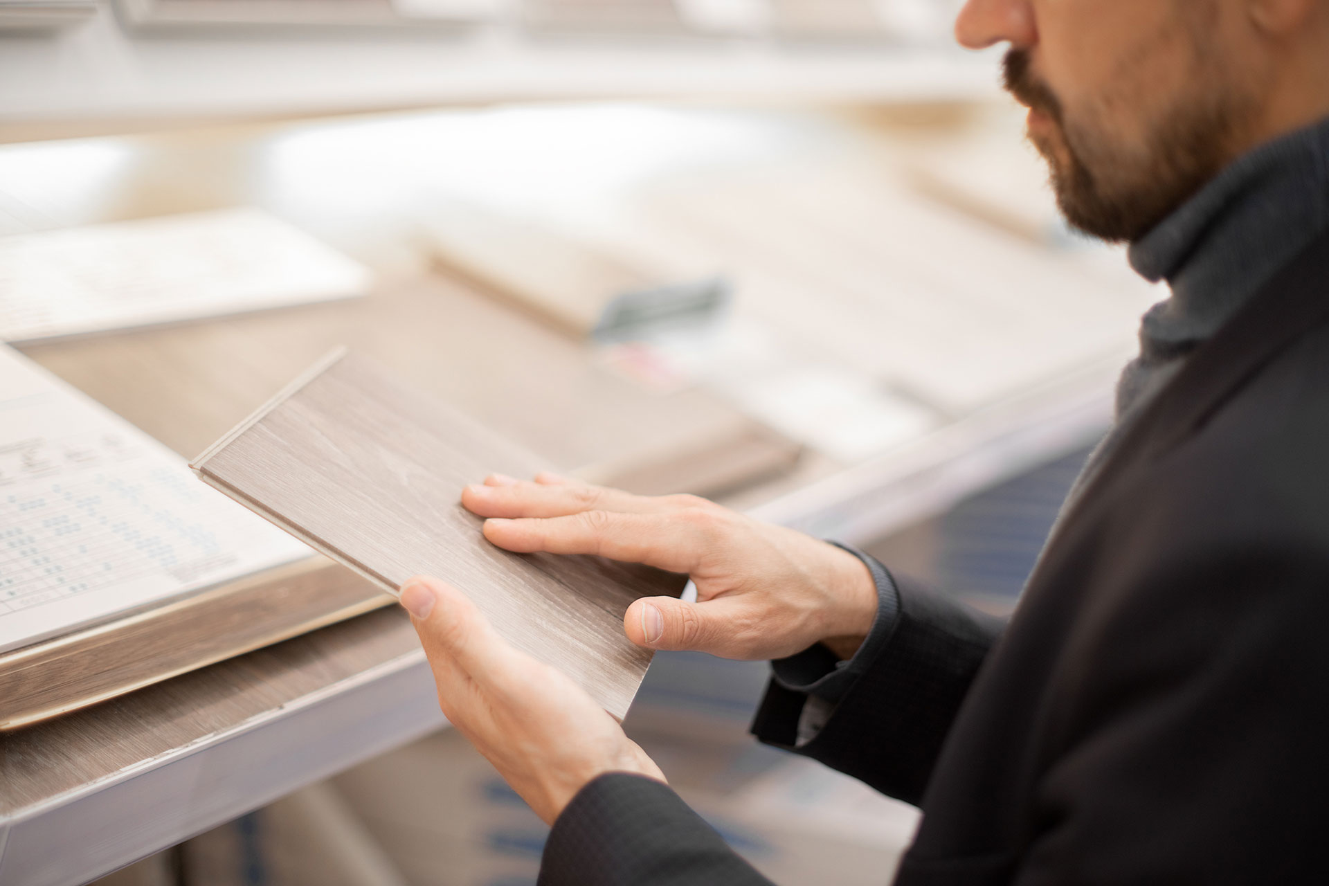someone choosing between LVT vs laminate flooring