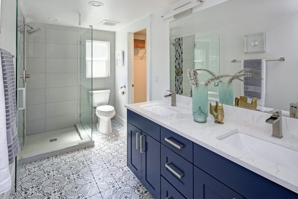 a modern bathroom with patterned tiles on top of underfloor heating