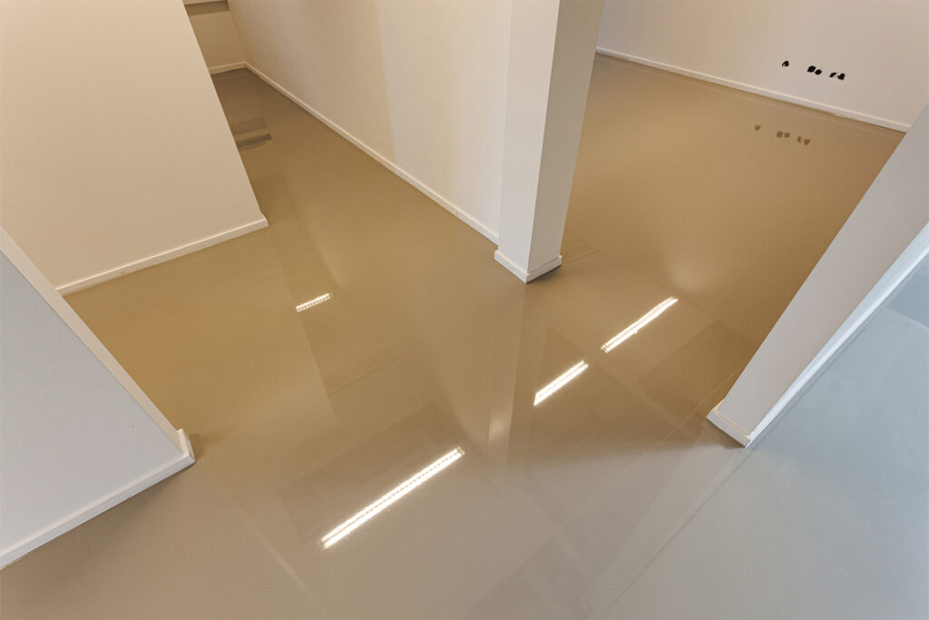 a polished resin floor installed over underfloor heating