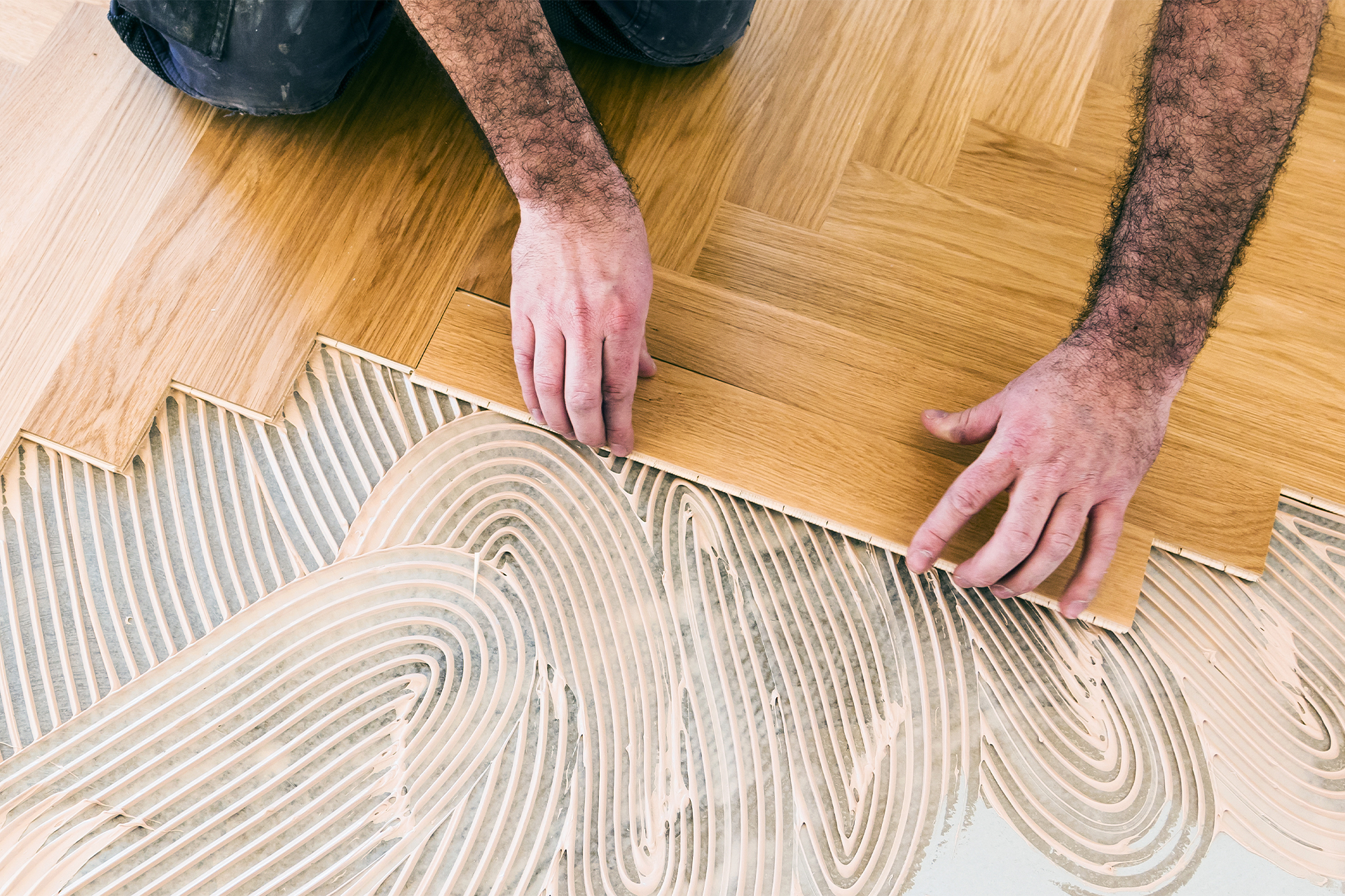 a homeowner laying herringbone vs chevron flooring